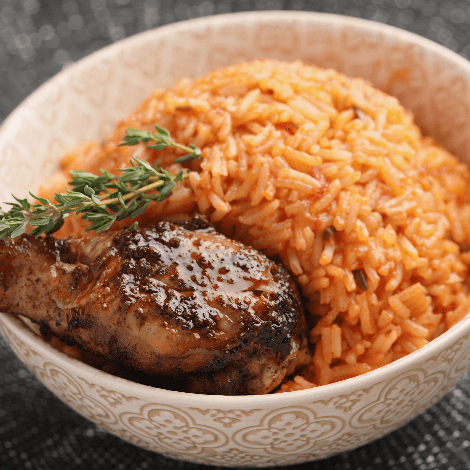 Nigerian jollof rice with a chicken thigh