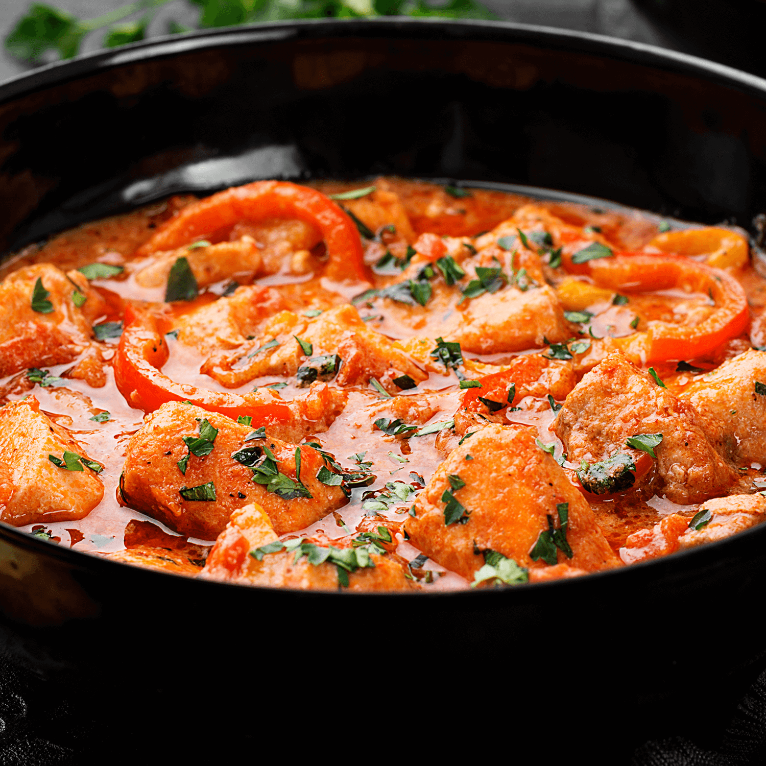 Fish stew cooked in a delicious rich and fragrant broth topped with fresh parsley and served with rice