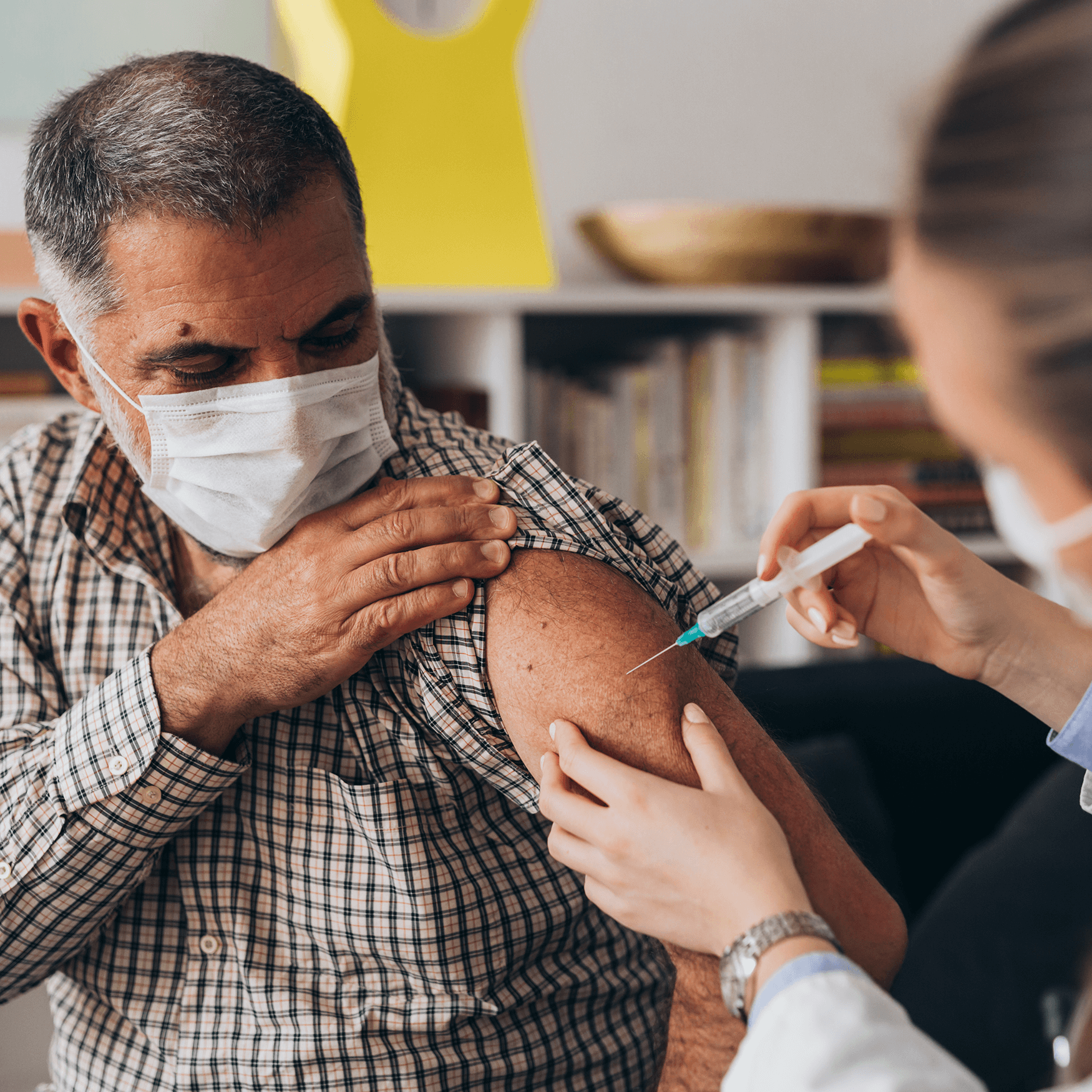 Man receiving COVID-19 vaccination