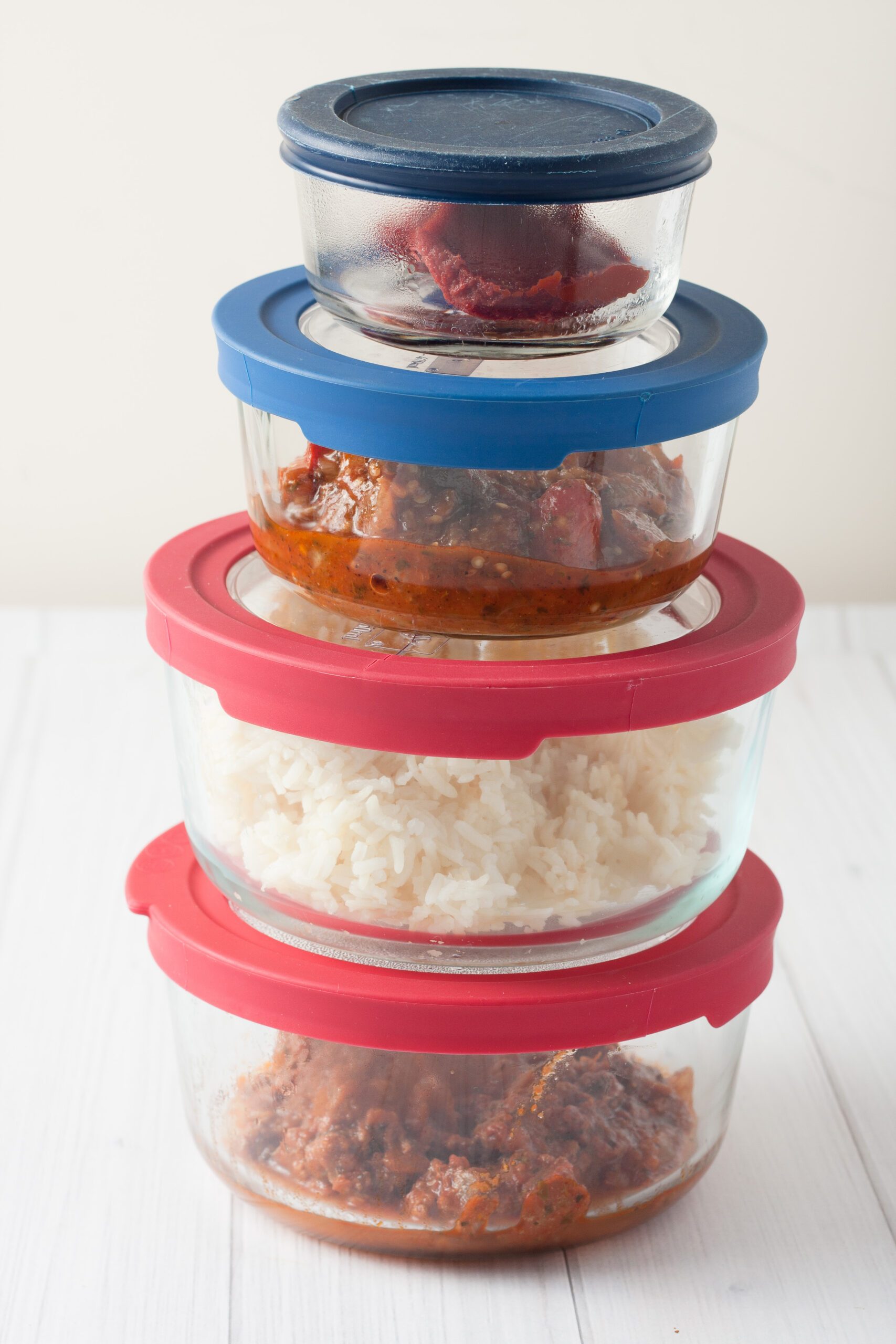 Stack of glass containers filled with leftovers