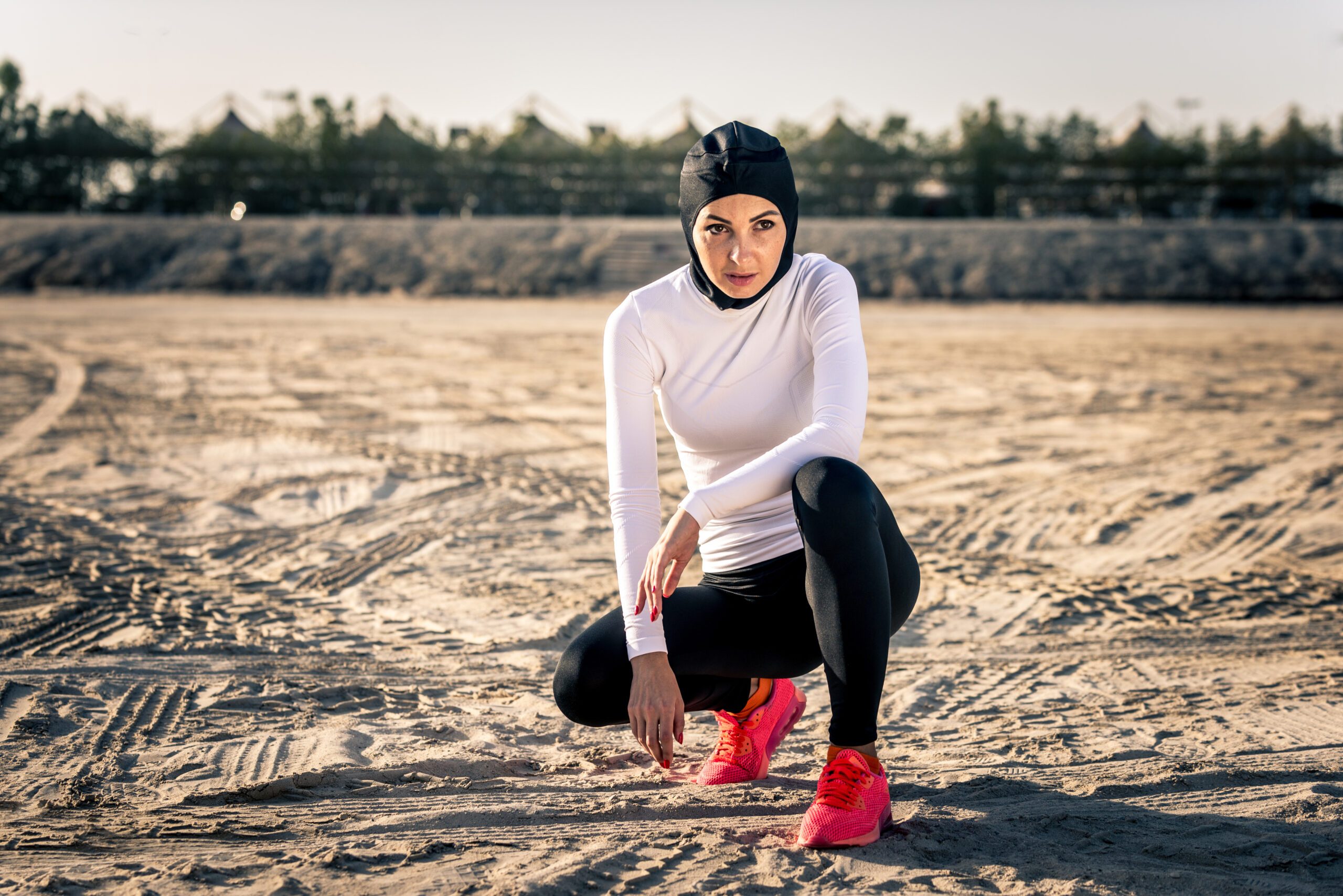 Woman wearing a hijab preparing for a run