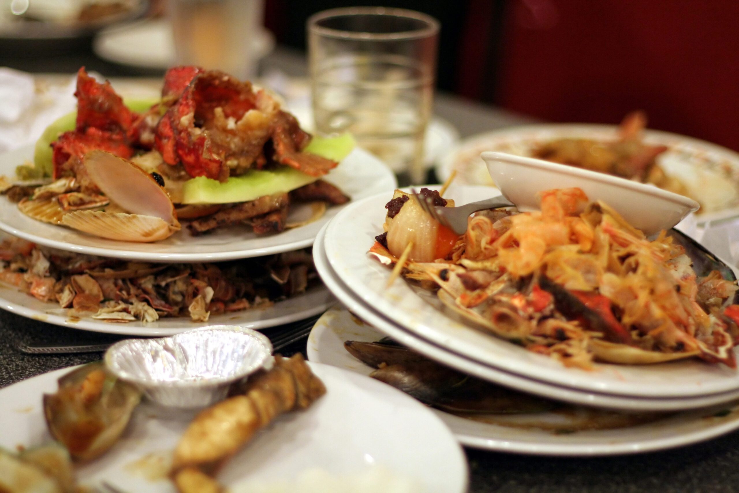 Plates piled with leftover food