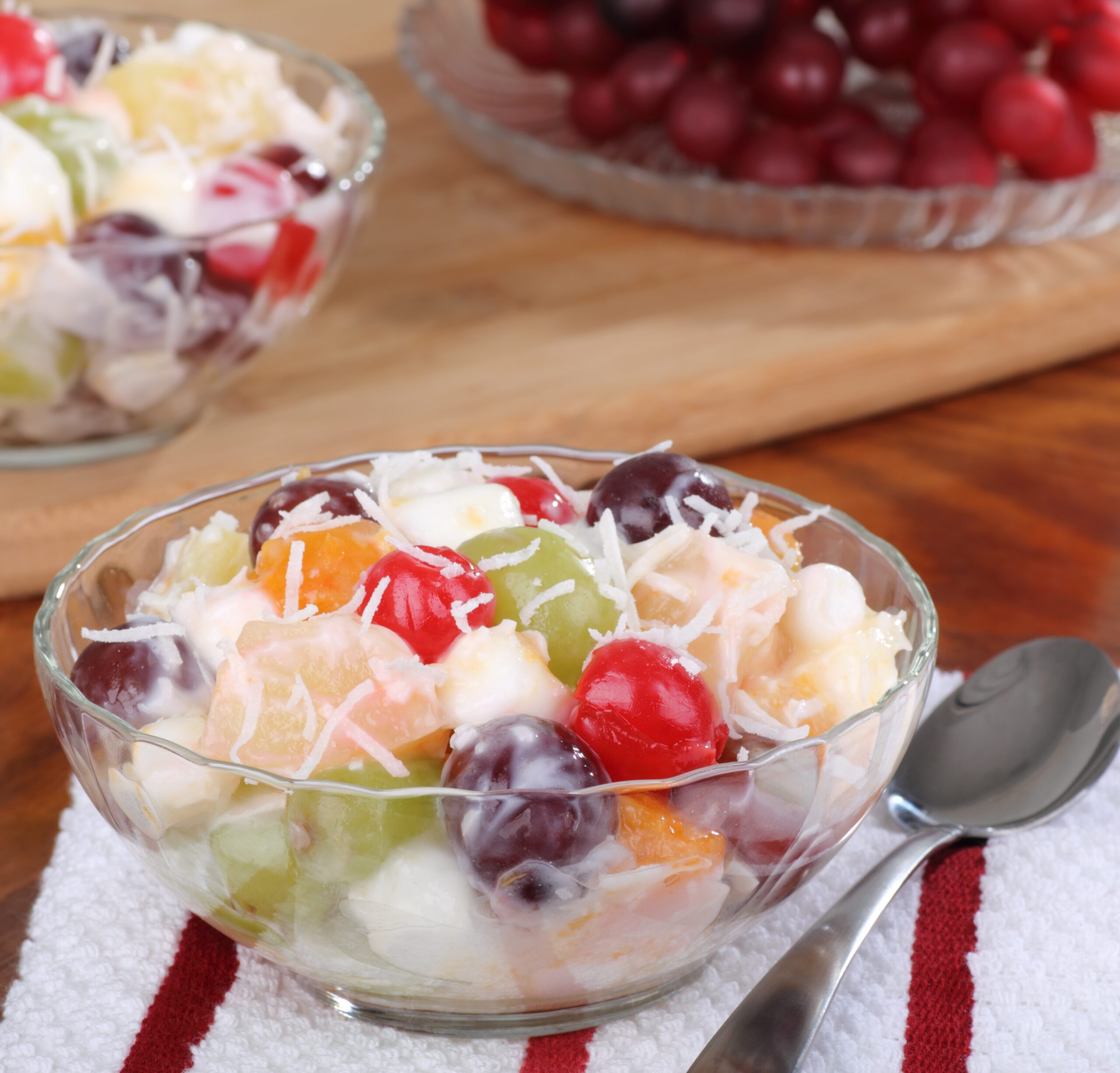 Fruit salad with cherries, grapes, and pineapple in a bowl