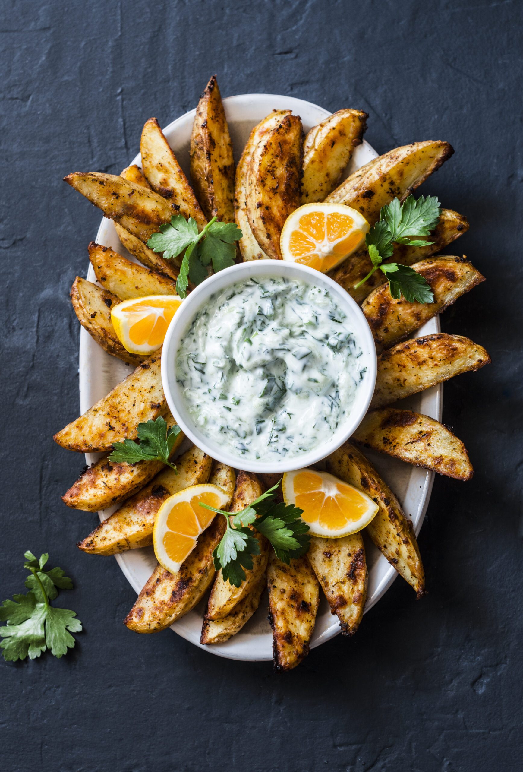 Greek lemon-baked potato and tzatziki sauce