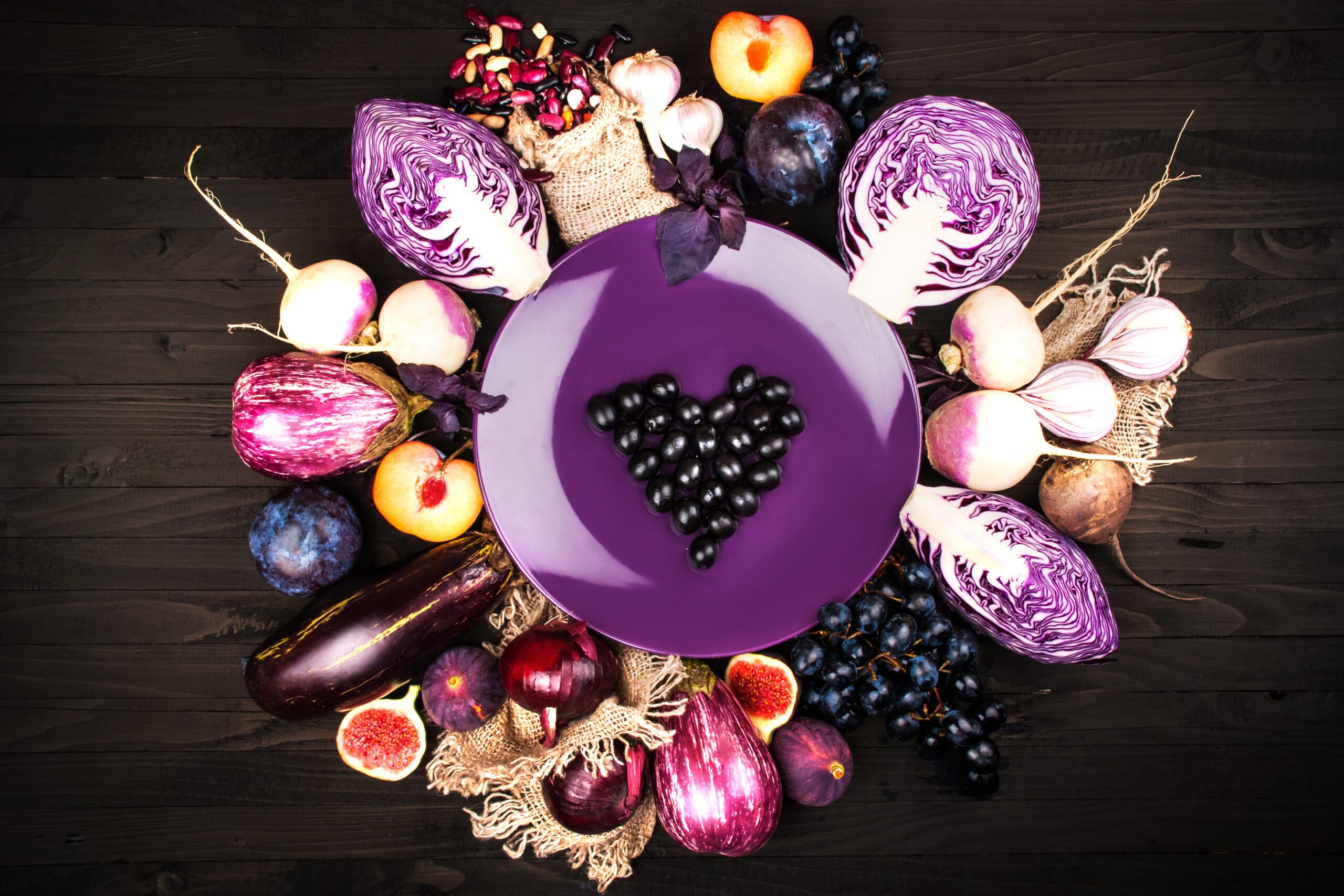 Purple vegetables on a wooden background