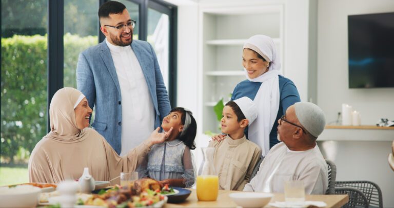Islamic, family and dinner in home for ramadan, muslim celebration and food on dining table. Eid mubarak, culture and religious gathering with grandparents, children and mom or dad for bonding.