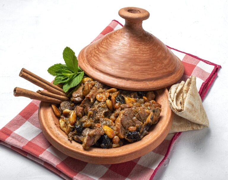 Traditional moroccan lamb meat tagine from above. Halal food. Typical arabic food. flat lay