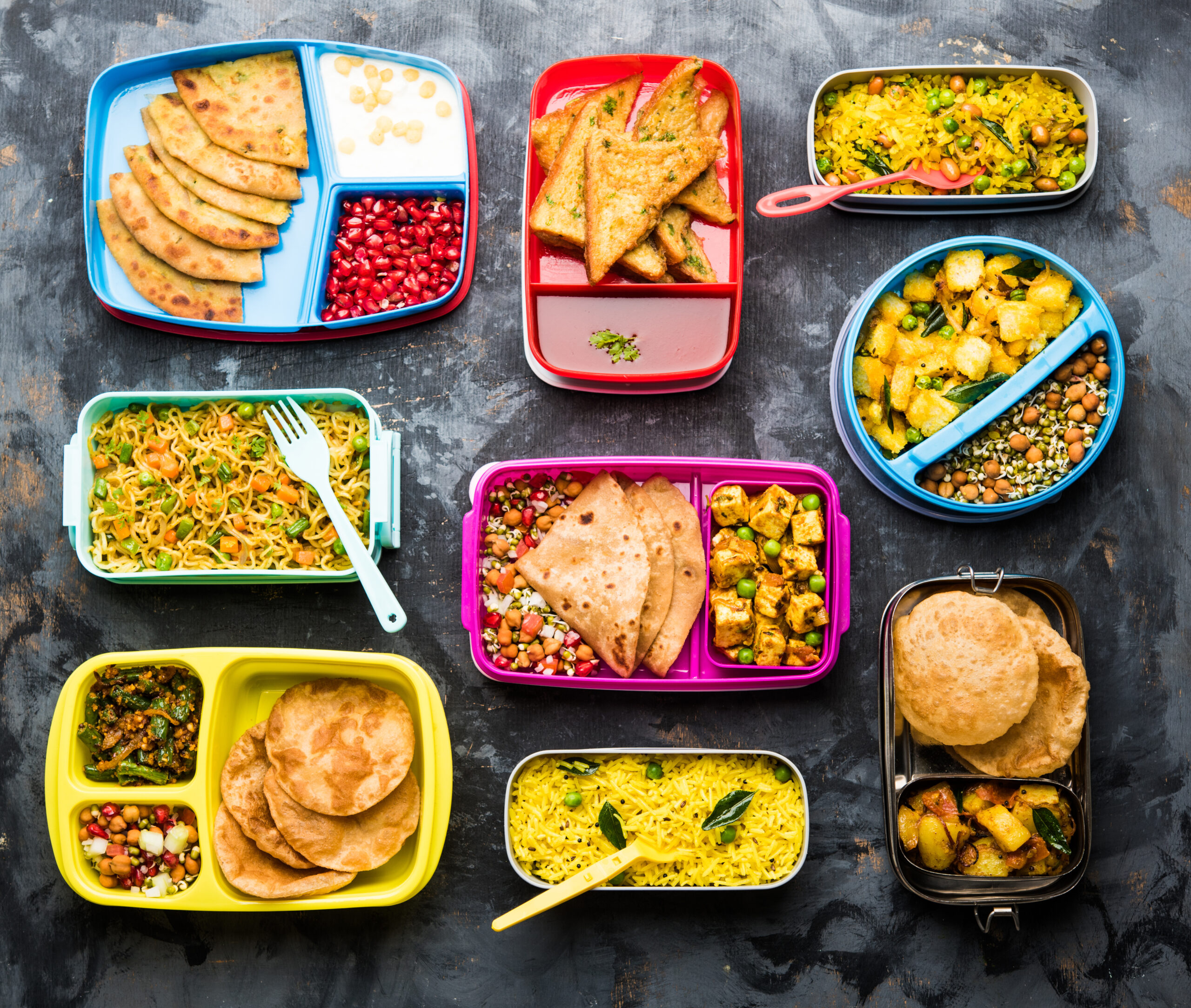 group of Lunch Box / Tiffin for Indian kids, showing variety or multiple option or combination of healthy food for your school going children